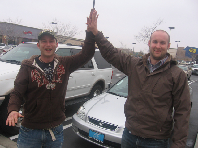 Cory and Justin celebrating the recovery of some keys that were dropped in a sewer grate thing. EW! But they did it!!