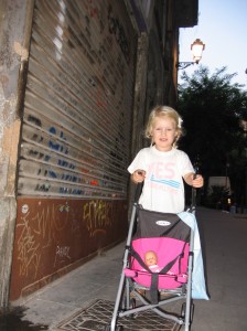 Maisie loves to push her own stroller when going for walks