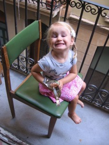Maisie enjoying one of the last chocolate Koala bars she will have for a long, long time on the little balcony
